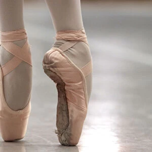 A ballet dancer performs on blocked shoes during a classical class at the Prix de