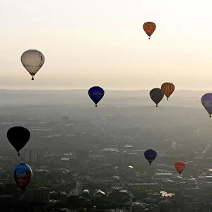 Balloons fly across Bristol city centre during the 2006 Bristol International Balloon