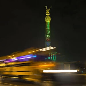 The Berlin Victory Column is illuminated during the Festival of Light show in Berlin