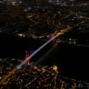 Bosphorus strait and the Fatih Sultan Mehmet Bridge are pictured through the window of a Bosphorus strait and the Fatih Sultan Mehmet Bridge are pictured through the window of a