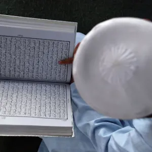 A boy reads the Koran in Mathura