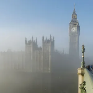 A bride poses for a photograph on Westminster Bridge as the fog clears in central London A bride poses for a photograph on Westminster Bridge as the fog clears in central London
