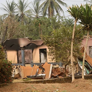 A burned and damaged building is seen in Kembong