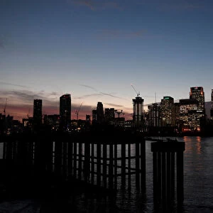 The Canary Wharf financial district is seen at dusk in London