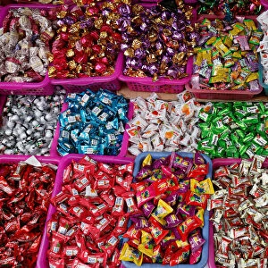 Candies are displayed for sale on a street in Hanoi