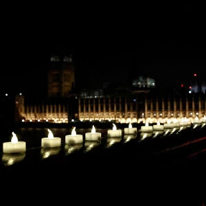 Candles burn on Westminster Bridge the day after an attack in London