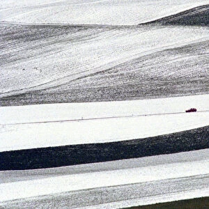 CAR DRIVES THROUGH SWISS LANDSCAPE AFTER RECENT SNOWFALLS
