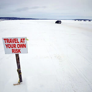 Car travels the ice road on Lake Superior between Bayfield, Wisconsin and Madeline Island