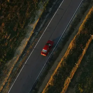 A car travels on a road near Donana Natural Reserve, southwest Spain A car travels on a road near Donana Natural Reserve, southwest Spain