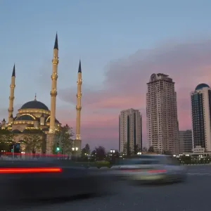 Cars drive along Akhmad Kadyrov Avenue, with the Heart of Chechnya mosque and skyscrapers Cars drive along Akhmad Kadyrov Avenue, with the Heart of Chechnya mosque and skyscrapers