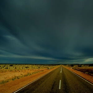 CLOUDS GATHER OVER PETERMANN ROAD IN CENTRAL AUSTRALIA