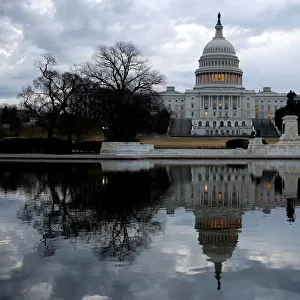 Clouds pass over the U. S. Capitol at the start of the third day of a shut down of the