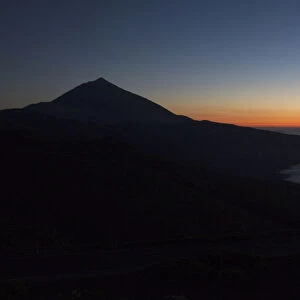 Clouds surround the Teide volcano at sunset in Tenerife