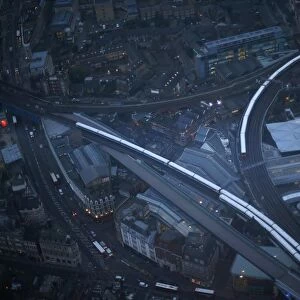 Commuter trains are seen at dusk in an aerial photograph from The View gallery at the Shard