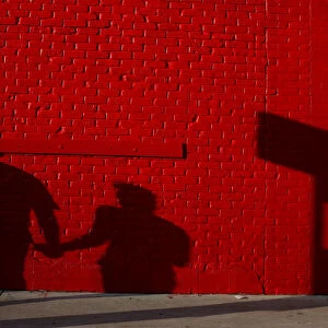 A couple casts a shadow on the wall during the South by Southwest Music Film Interactive