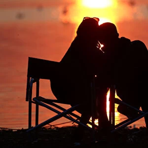 Couple enjoys a sunset at a lake on the outskirts of Minsk