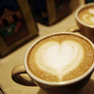 Cups of cappuccino sit on a table during the World Coffee Conference in Guatemala City