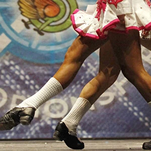 Two dancers pass each other as they compete in a heat during the All Scotland Championships