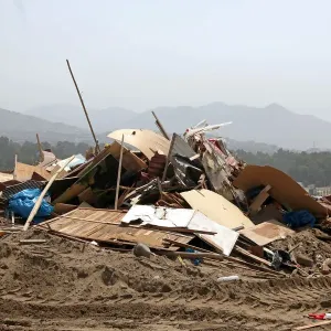 Debris of huts are seen after police evict squatters from a land in Villa El Salvador