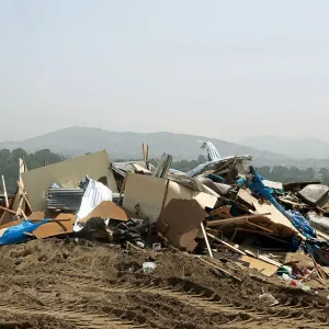 Debris of huts are seen after police evict squatters from a land in Villa El Salvador
