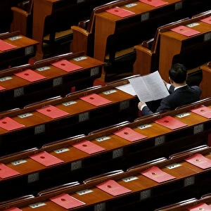 Delegate is seen inside the Great Hall of the People before the closing session of