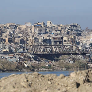 Destroyed buildings from previous clashes are seen in Mosul