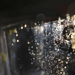 A devotee washes his head at the Balaju Baise Dhara during the Baishak Asnan festival in