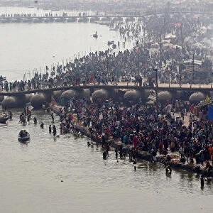 Devotees take a holy dip at Sangam, the confluence of the Ganges