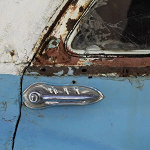 A door of a rusty vintage car is pictured in Havana