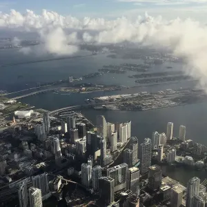 Downtown Miami is pictured in this aerial photo as clouds begin to form in advance of Downtown Miami is pictured in this aerial photo as clouds begin to form in advance of
