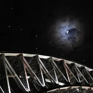 Earths shadow falls on the moon as it undergoes a total lunar eclipse above the Sydney