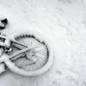 A fallen bicycle lies in the snow in Cambridge in eastern England A fallen bicycle lies in the snow in Cambridge in eastern England