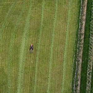 A farmer works on a field in Friedrichshafen