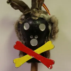 A figure on the top of a stick used by a believer is seen before the Endiablada