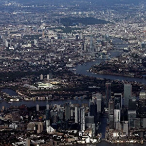 FILE PHOTO: Canary Wharf and the City of London financial district are seen from an