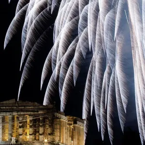 Fireworks explode over the ancient Parthenon temple atop Acropolis hill during New Fireworks explode over the ancient Parthenon temple atop Acropolis hill during New