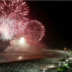Fireworks explode above Copacabana beach in Rio de Janeiro at midnight Fireworks explode above Copacabana beach in Rio de Janeiro at midnight