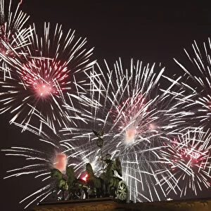 Fireworks explode next to the Quadriga sculpture atop the Brandenburg gate during New