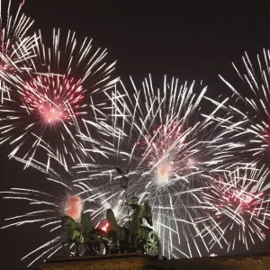 Fireworks explode next to the Quadriga sculpture atop the Brandenburg gate during Fireworks explode next to the Quadriga sculpture atop the Brandenburg gate during