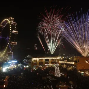 Fireworks explode beside Viennas Giant Ferris Wheel at Prater park during New Year Fireworks explode beside Viennas Giant Ferris Wheel at Prater park during New Year