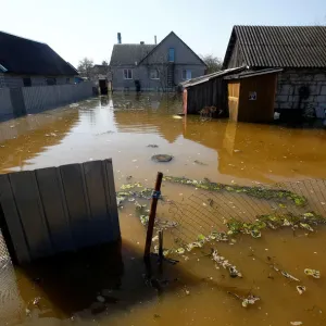 A flooded courtyard is seen as water from the Neman river overflows its banks during A flooded courtyard is seen as water from the Neman river overflows its banks during