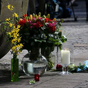 Flowers are seen on the site where on April 7 a man drove a van into a group of people