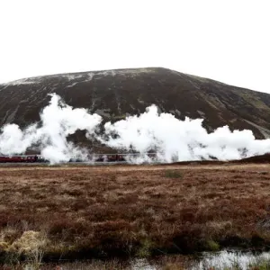 The Flying Scotsman steam train travels north through the Drumochter Pass, Scotland The Flying Scotsman steam train travels north through the Drumochter Pass, Scotland