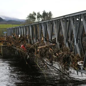 A footbridge lies littered with debris following flooding at Newton Stewart in Scotland