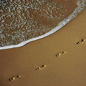 Footprints are left on the shore of Sydneys Bronte Beach