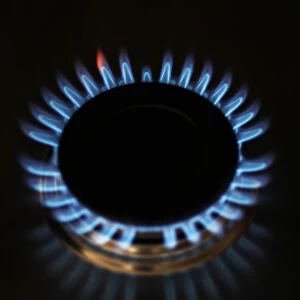 Gas flames are seen burning on a cooker in London