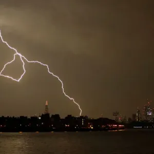 General view as lightning strikes over the city of London, Britain