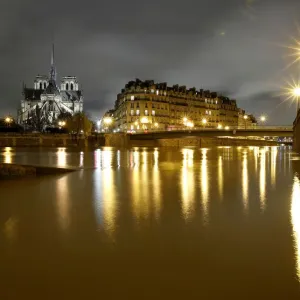 A general view shows the Notre Dame Cathedral at night, on the flooded banks of the River A general view shows the Notre Dame Cathedral at night, on the flooded banks of the River
