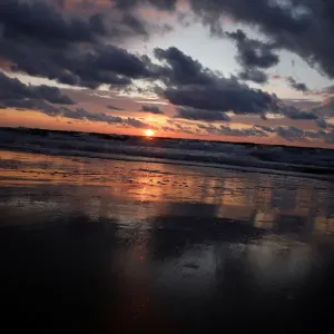 General view of the sunset pictured from the beach at the Polish Baltic Sea coast General view of the sunset pictured from the beach at the Polish Baltic Sea coast