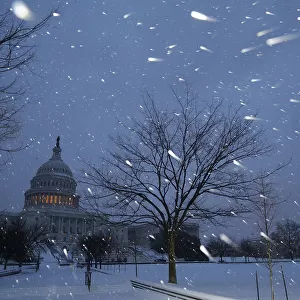 A general view of the U. S. Capitol in early morning snow in Washington